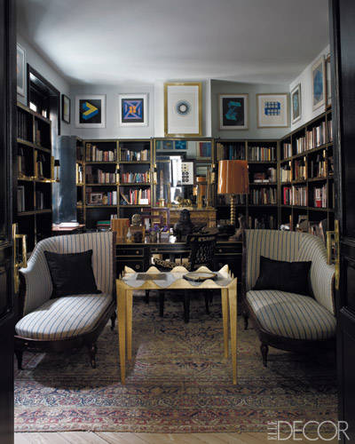 Charles X–style chaise longues from the 19th century flank a Garouste & Bonetti table in the library; Op Art prints and paintings by ­Yturralde and Victor Vasarely hang above lacquer-and-brass shelves designed by Castillo, and the Persian rug is 18th century.