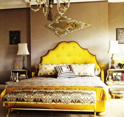 For a Manhattan apartment bedroom Alex Papachristidis enveloped the glamorous custom-made bed in bright yellow-gold silk from Donghia. Photo by Simon Upton.