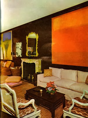 An orange abstract painting sets the tone in a monochromatic living room decorated by Billy Baldwin. From Billy Baldwin Decorates.