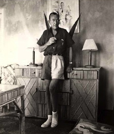 Noel Coward in his Round Hill cottage, which he named Firefly.