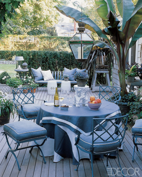 Vntage iron garden furniture dresses the terrace of Geoffrey Ross and John Dransfield’s Hamptons house with outdoor fabrics from their own line. Photo by William Waldron.