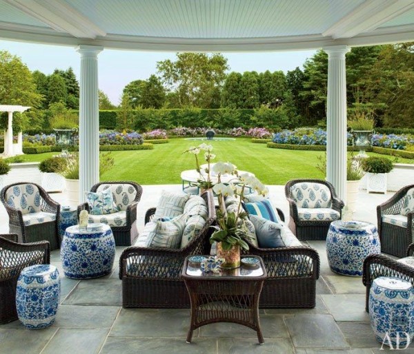 Mario Buatta extended his passion for chintz onto the wicker furniture of a veranda he designed for Hilary and Wilbur Ross's bucolic setting in the Hampton's. Photo by Scott Frances.