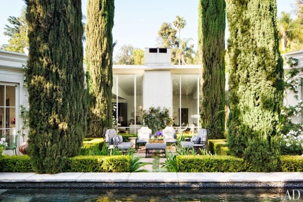 Classical proportions inform the terrace and landscape design of Jeff Klein and John Goldwyn's Hollywood Regency home. Photo by Roger Davies.