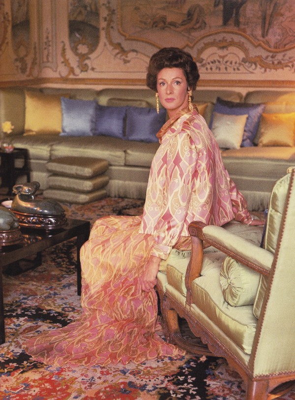 Marella Agnelli photographed by Horst in the piano nobile's main salon with a sofa designed by Stephane Boudin and panels of antique Chinese wallpaper.
