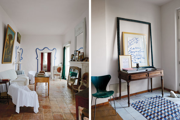 A rarely used sitting room in the main house, where the furniture is covered in muslin sheets and an antique mirror keeps cold air from entering through the fireplace; the entryway of the house where Del Roscio now stays when he is in Gaeta, with a chair by Arne Jacobsen, 18th-century Neapolitan floor tiles and a poster for a Twombly show at Gagosian Gallery from 2008, framed with a vintage Del Roscio find.(T Magazine; photos by Simon Watson).